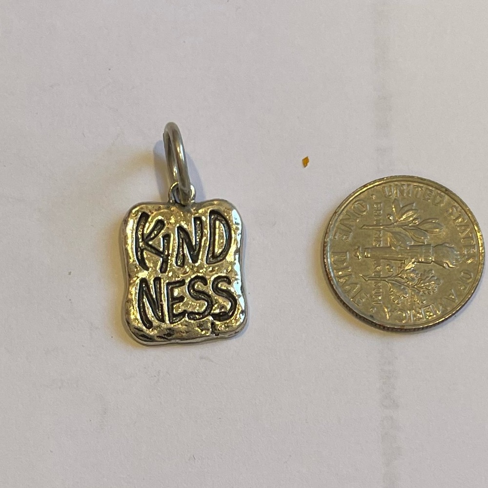 Sterling silver kindness charm waxing poetic